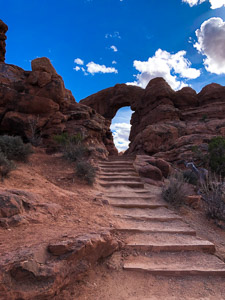 Natural stone arch pathway desert