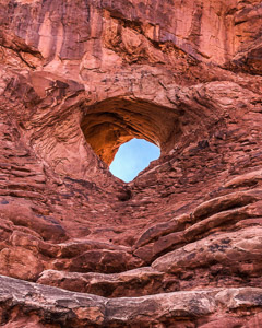 Red rock arch blue sky